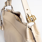 Close-up of Wetherby Tote by Freedman Harness – Putty leather shoulder bag featuring gold buckle hardware, adjustable strap, and contrast edge detailing