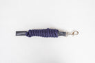 Freedman Harness navy paracord poly lead rope with premium black leather accents and a stainless steel snap on a white background.