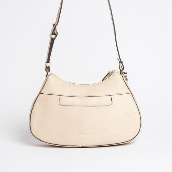 Back view of Carlisle Bag in putty leather by Freedman Harness – curved crossbody handbag with contrast stitching, back slip pocket, and adjustable strap