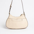 Back view of Carlisle Bag in putty leather by Freedman Harness – curved crossbody handbag with contrast stitching, back slip pocket, and adjustable strap