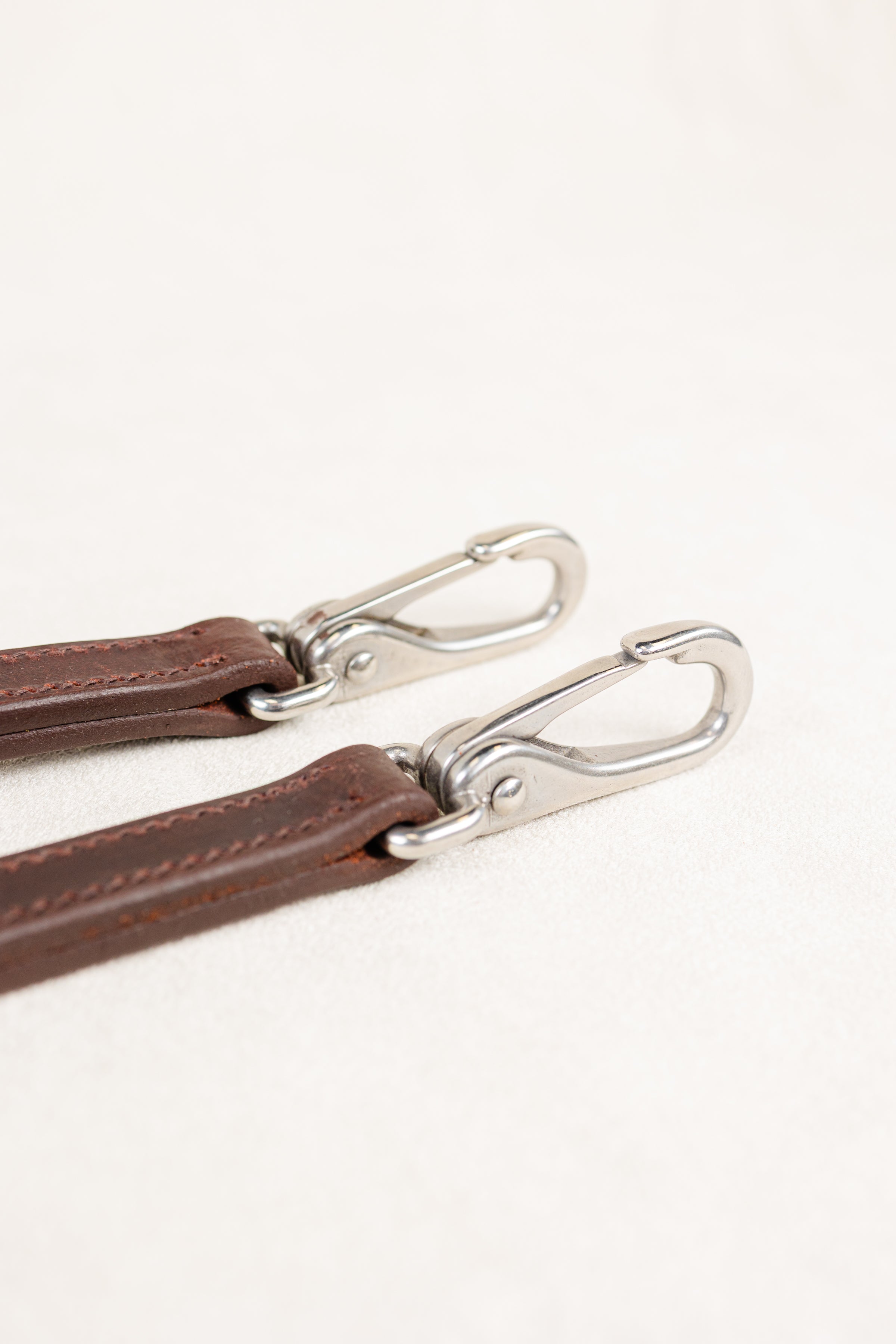 Close-up of Snap on ACTraining Snap Bridle Replacement Cheek, Brown Leather with Silver Hardware