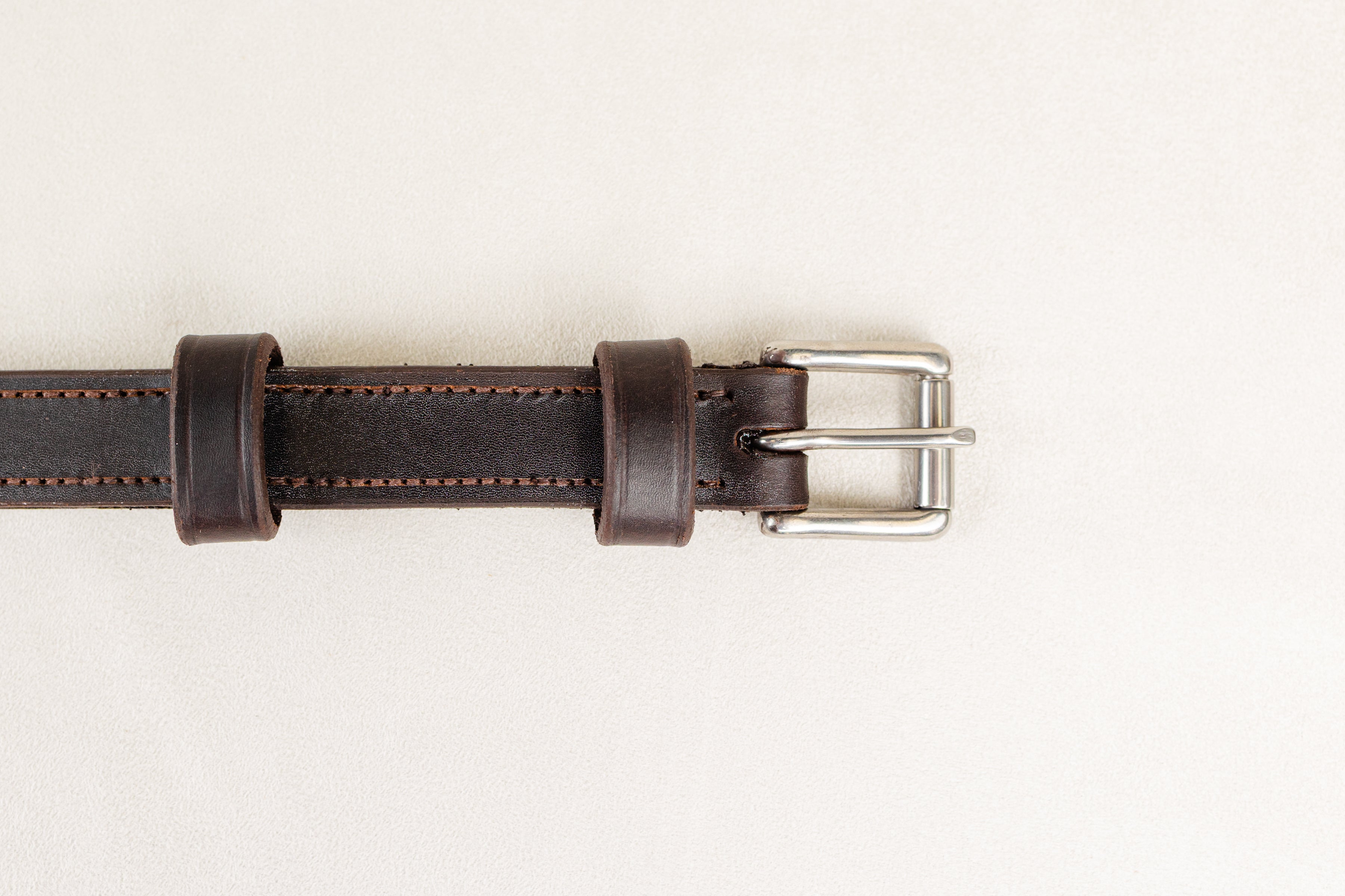 Close-up of Silver Buckle and Brown Leather Detailing on ACTraining Balance Strap.