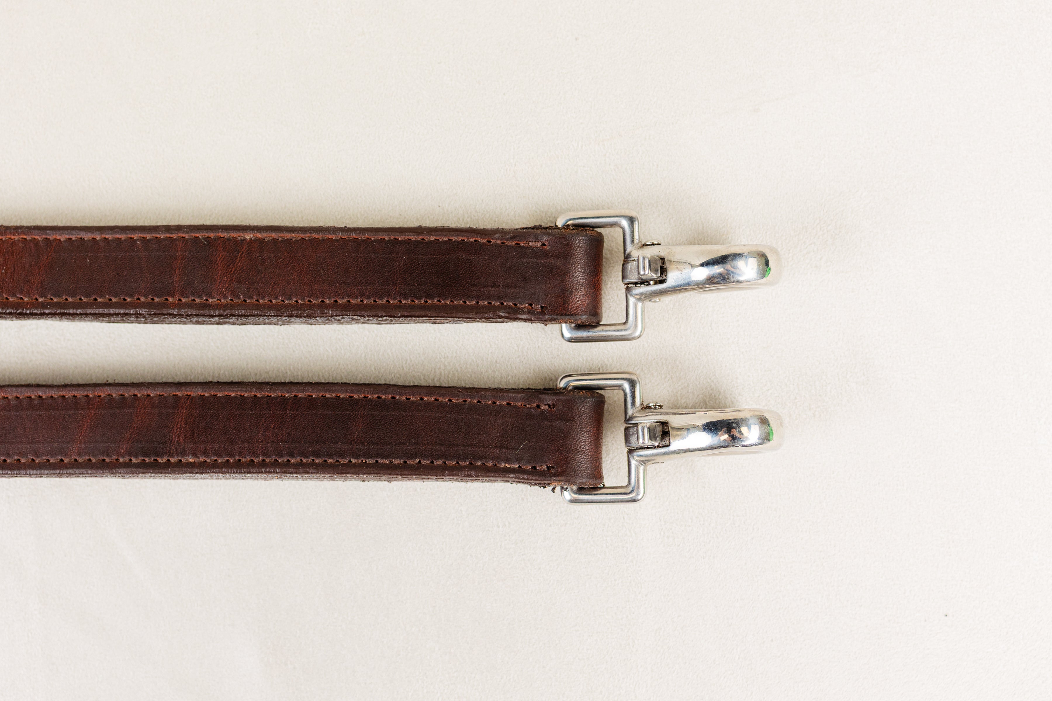 Close-up of Snap on ACTraining Snap Traces, Brown Leather with Silver Hardware, Detail.

