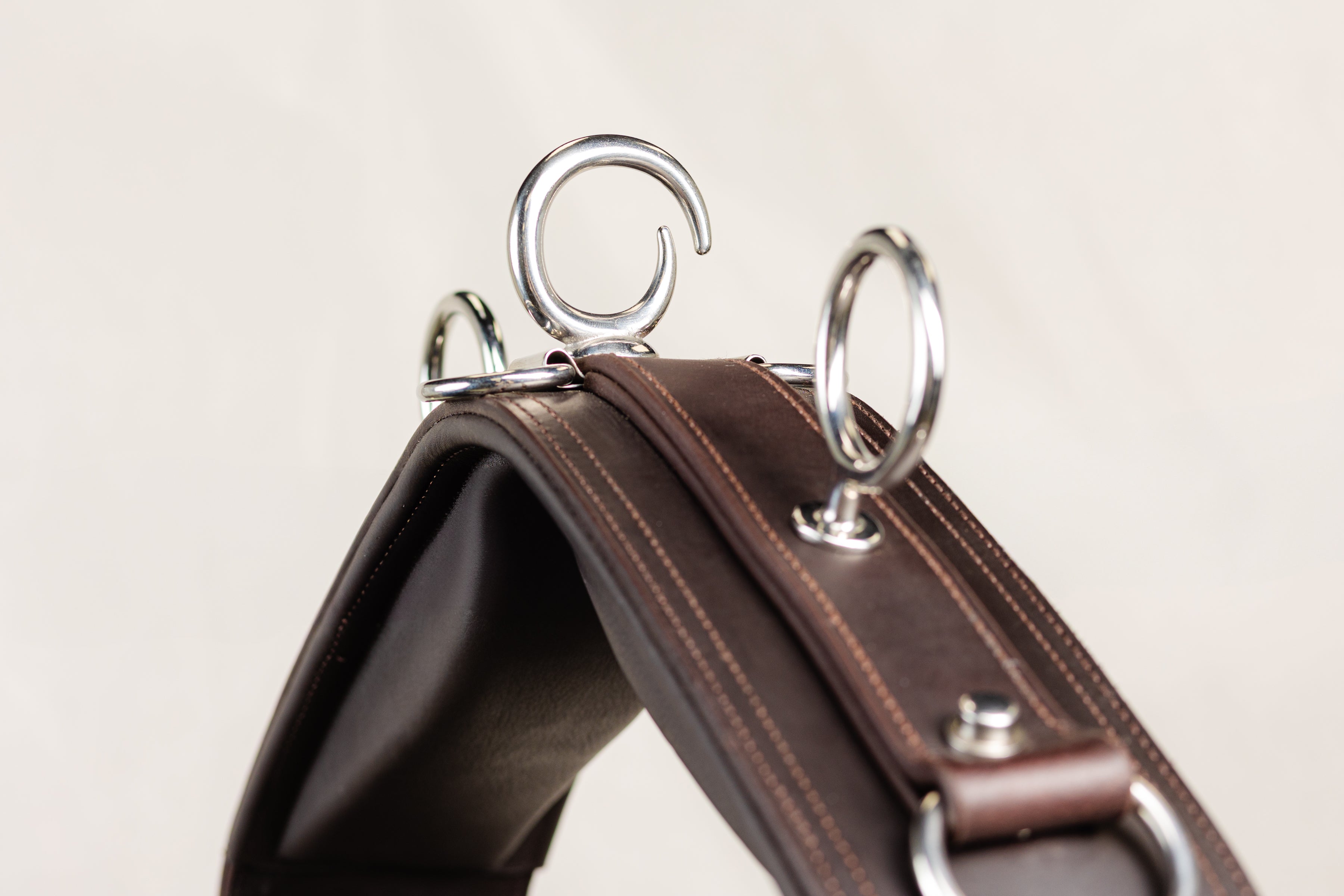 Close-up of Silver Metal Rings and Brown Leather Detailing on ACTraining Jog Pad with Belly Band