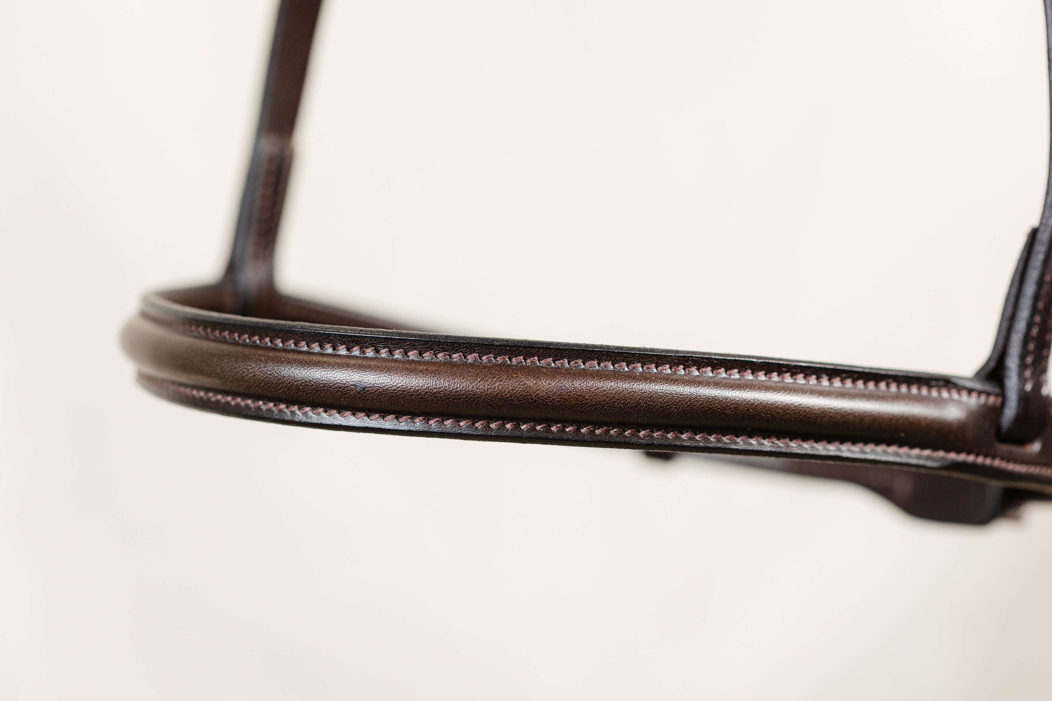 Close-up of a Brown Raised Hunter Caveson by Freedman's showcasing stich details.

