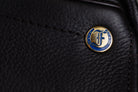 Close up of the Ultra XD cutback saddle showcasing the leather and Freedman's F logo.