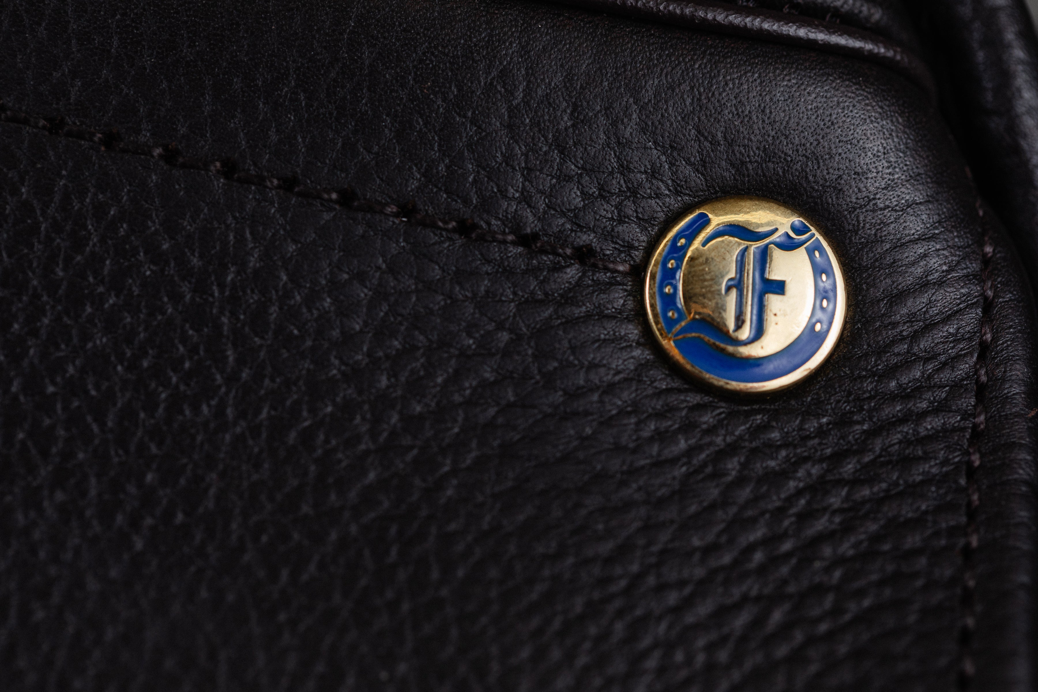Close up of the Ultra XD cutback saddle showcasing the leather and Freedman's F logo.