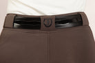 Back view of After Dark Brown Jods with a Patent Scalloped Spur Belt and Freedman’s “F” logo by Freedman’s Harness on a beige background.