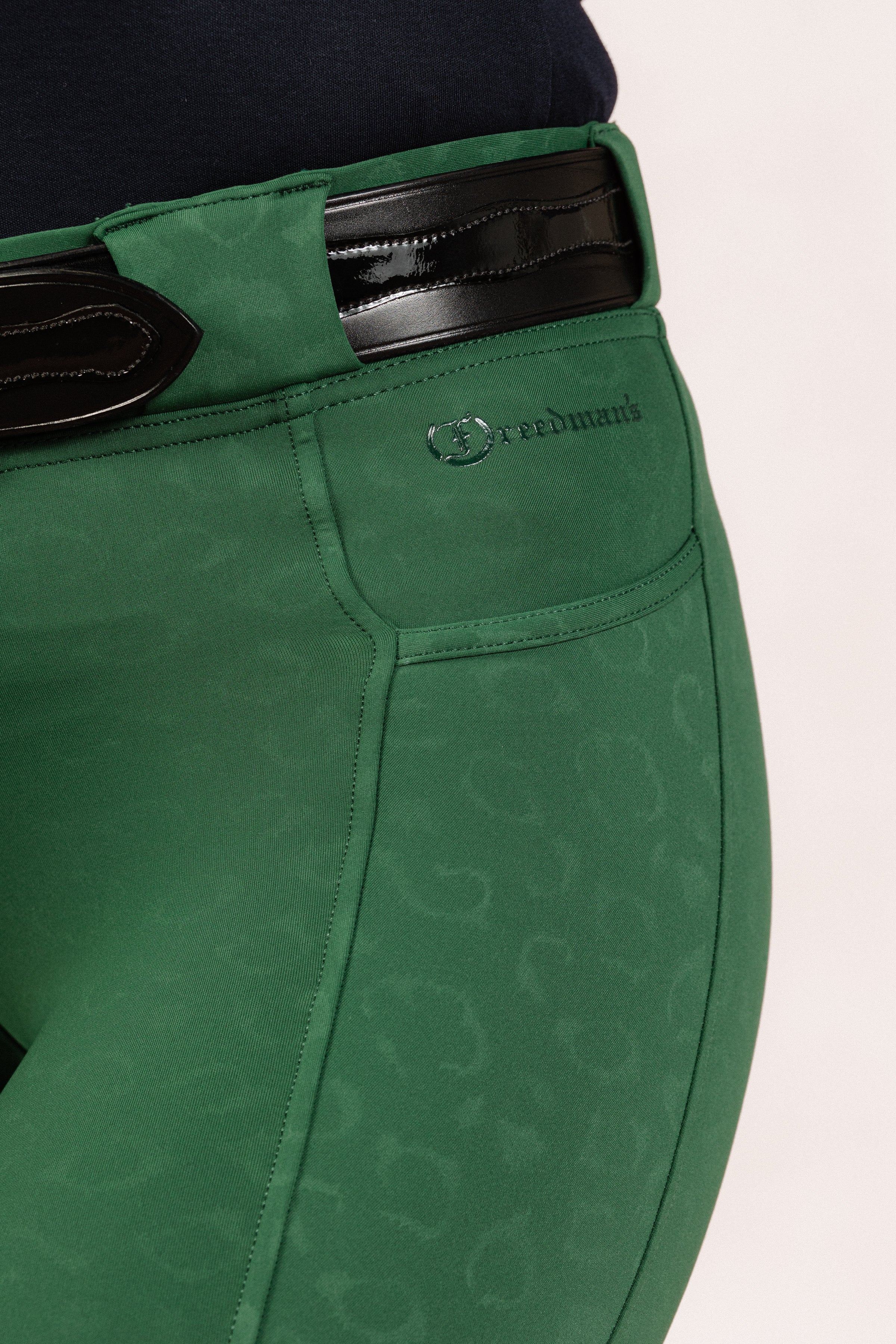 Green Cheetah Jods with a visible Freedman’s logo on a light background, made by Freedman’s Harness.