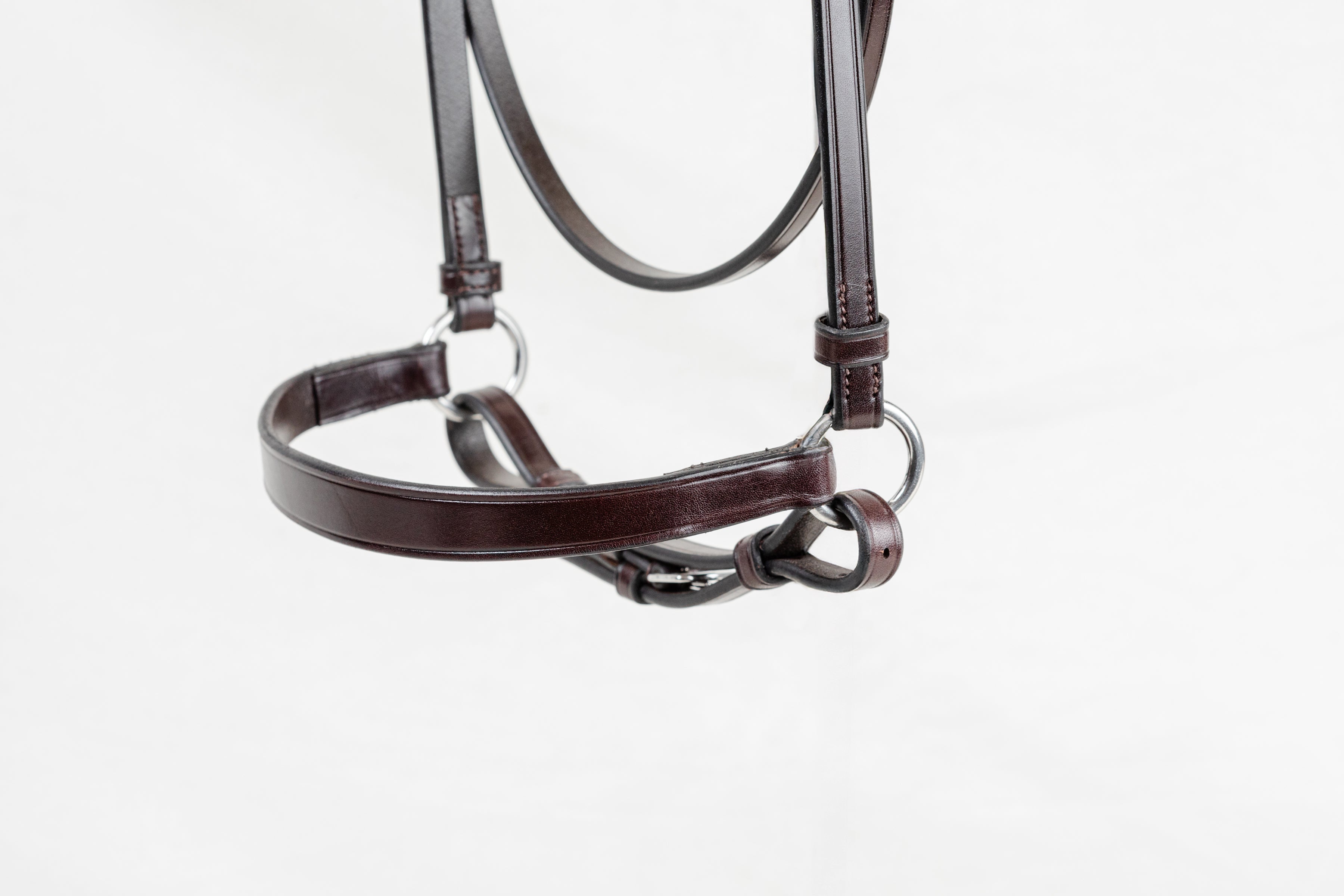 Brown leather horse bridle on a white background