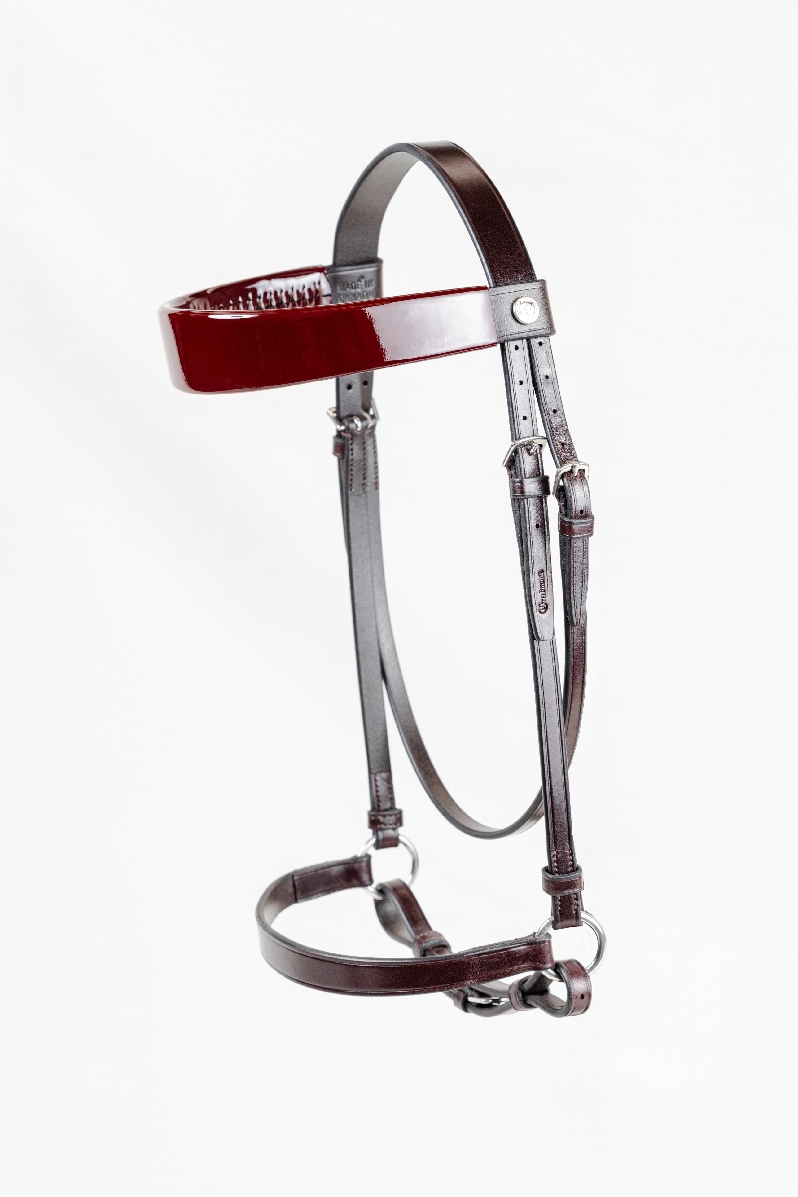 Freedman Harness Morgan Yearling Horse Show Halter in dark Havana leather, featuring a brilliant deep red patent leather browband and polished stainless steel hardware on a white background