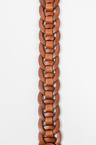 Close-up of brown leather Small Leather Ring Belt by Freedman's showing detailed woven leather rings, on a white background.