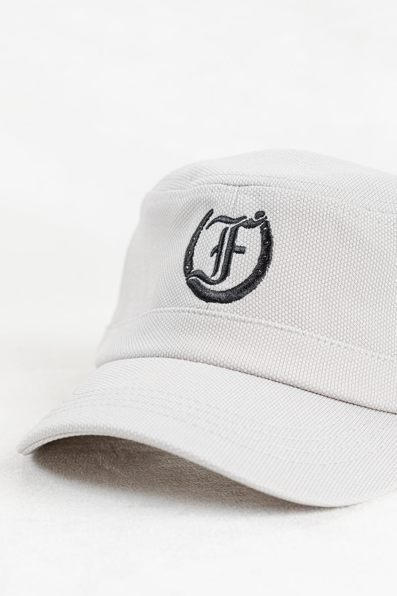 White cap with black Freedman Horseshoe Embroidered logo on a white background
