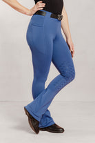 Women wearing stiffkey blue Jod with a plain background