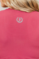 Pink Laser Tank Top with Freedman's "F" logo on a person wearing it, close-up view.