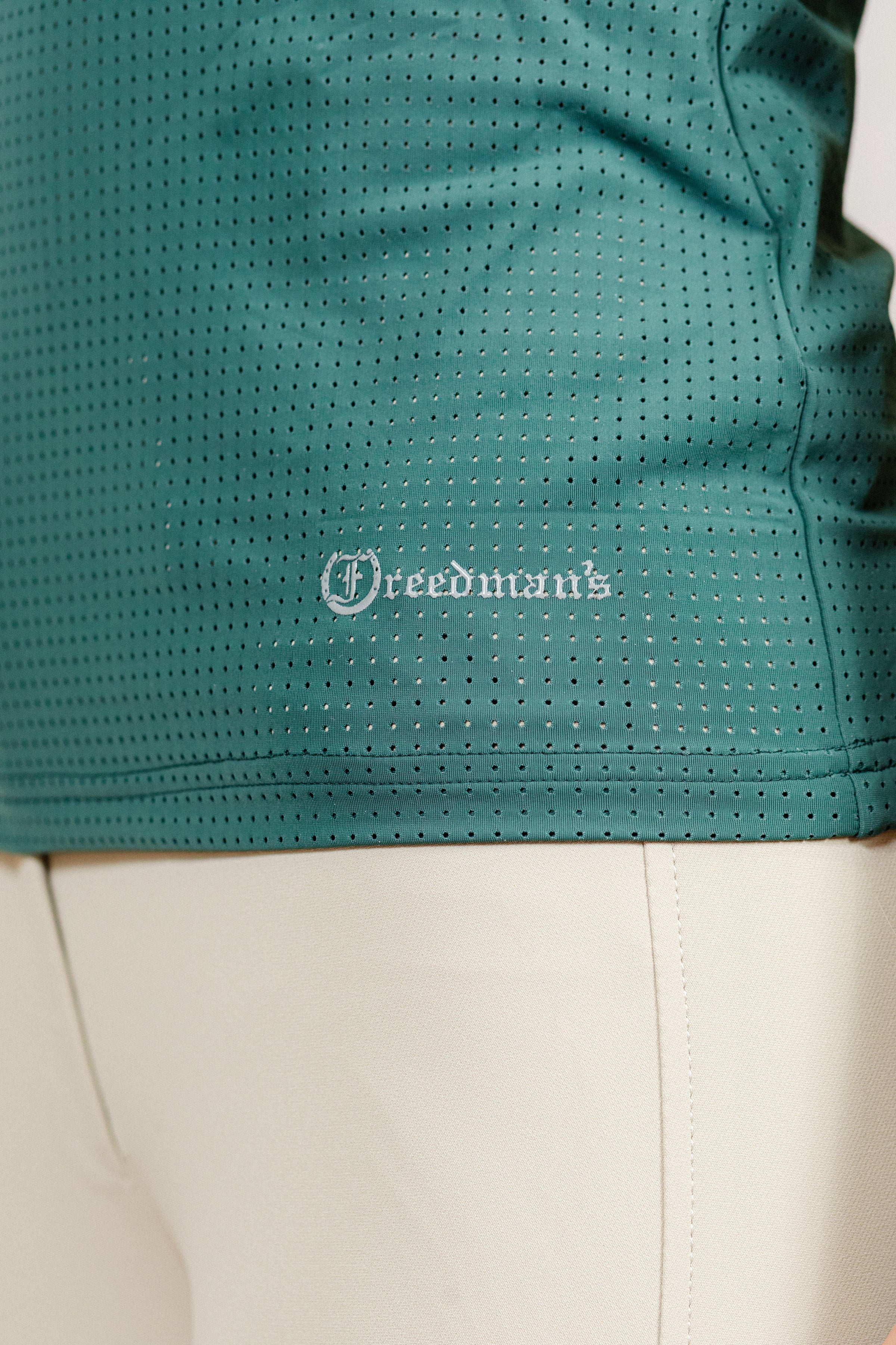Green Laser Top with 'Freedman's' logo close up detail