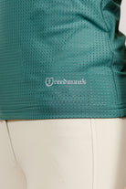 Green Laser Top with 'Freedman's' logo close up detail