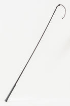 Full view of a Nylon Wrapped Riding Crop with a textured grip and braided shaft.