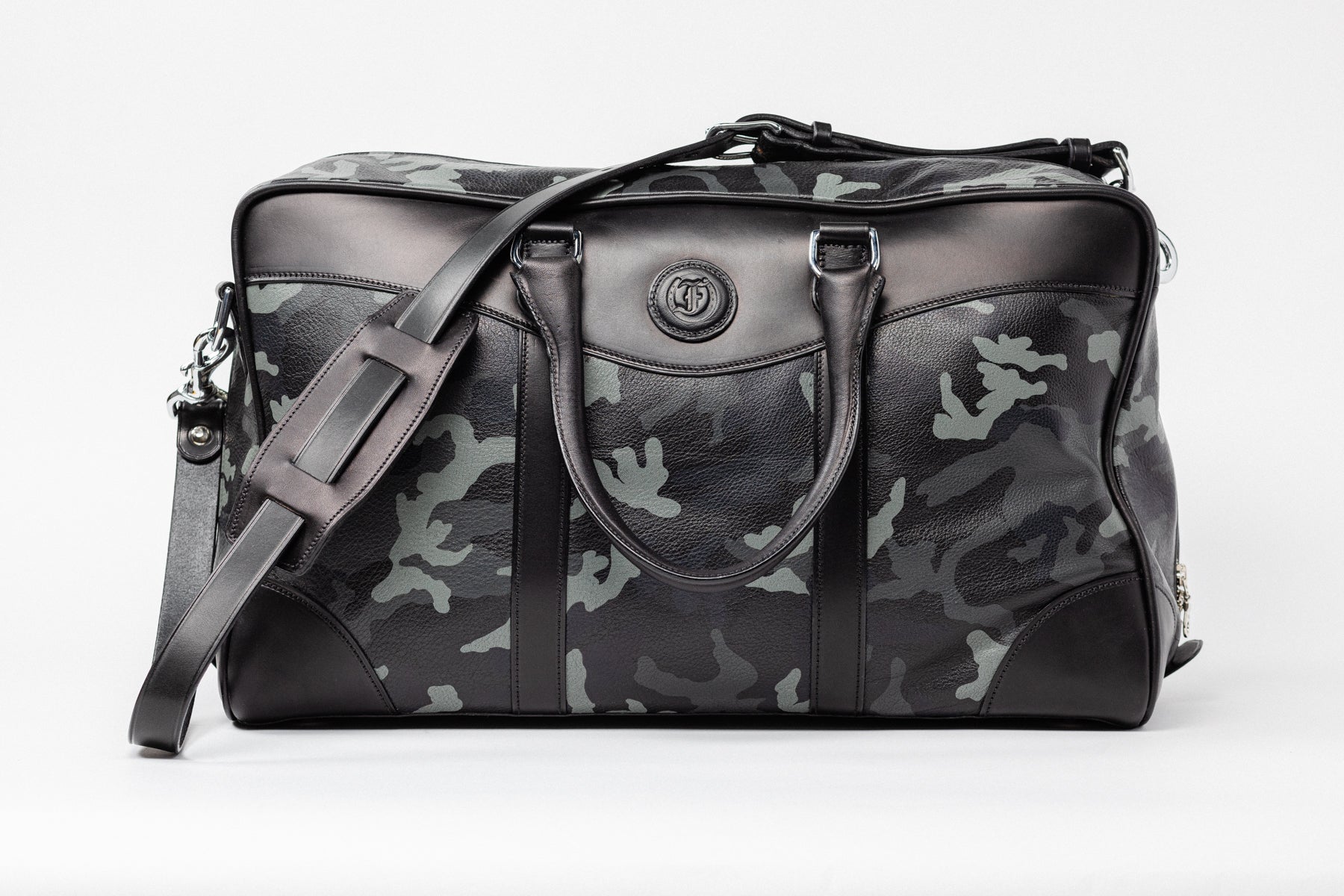 Camouflage leather overnight bag, The Stanhope by Freedman's, with detachable shoulder strap, dual handles, and embossed logo.