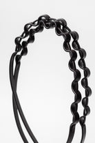 Close-up of black Bumpy Reins, showing the textured grip.