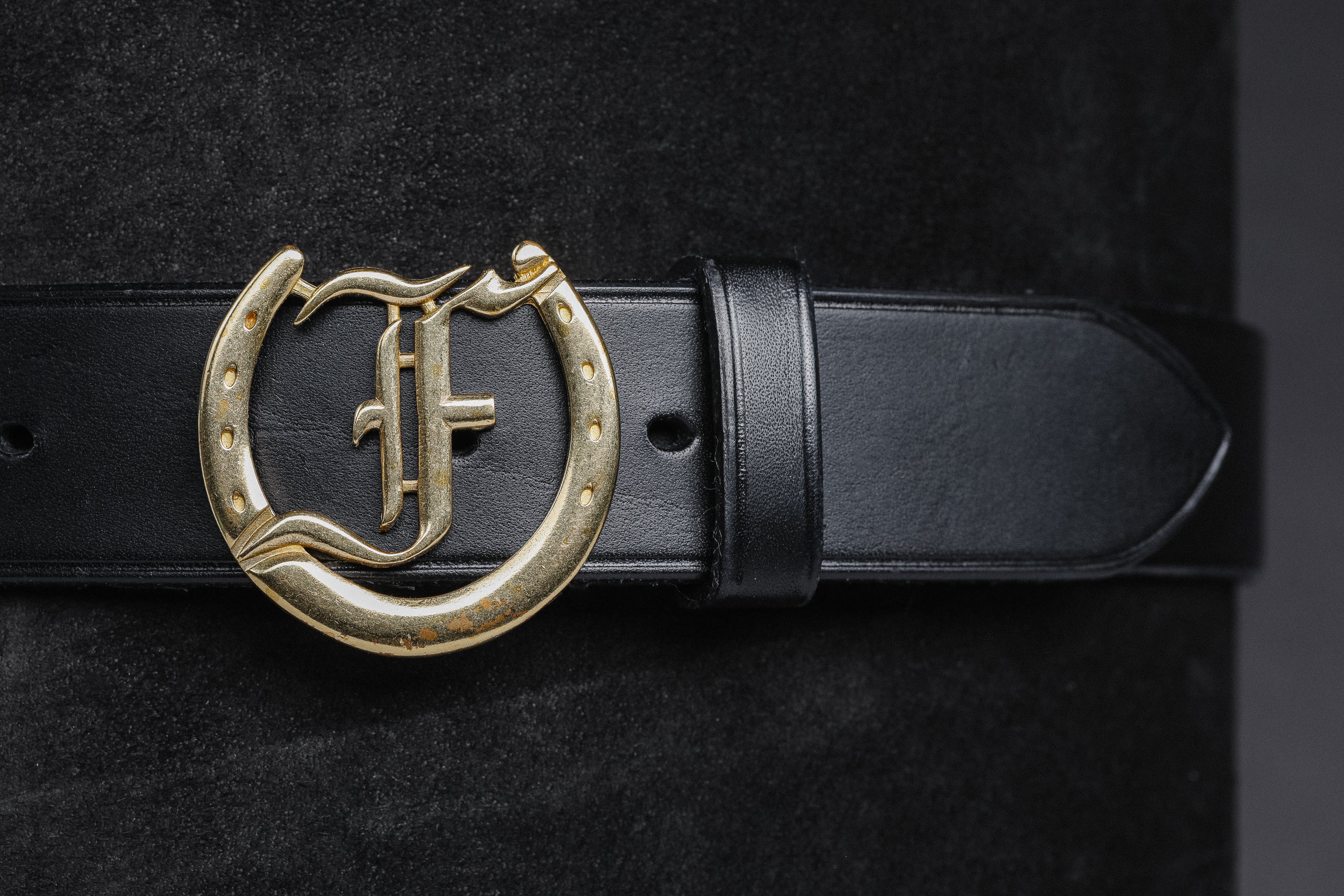 Freedman's Signature Logo Belt: Black Leather Belt with Brass Horseshoe Buckle and Embossed Brand Logo