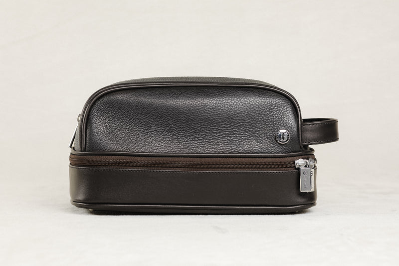 Freedman's Cardiff Shave Bag, brown textured leather, dual zippered compartments, silver hardware, side handle, light background.