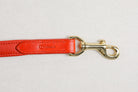 Close-up of a Raised Dog Leash showcasing the brass snaps with Freedman's logo stamped on leather.