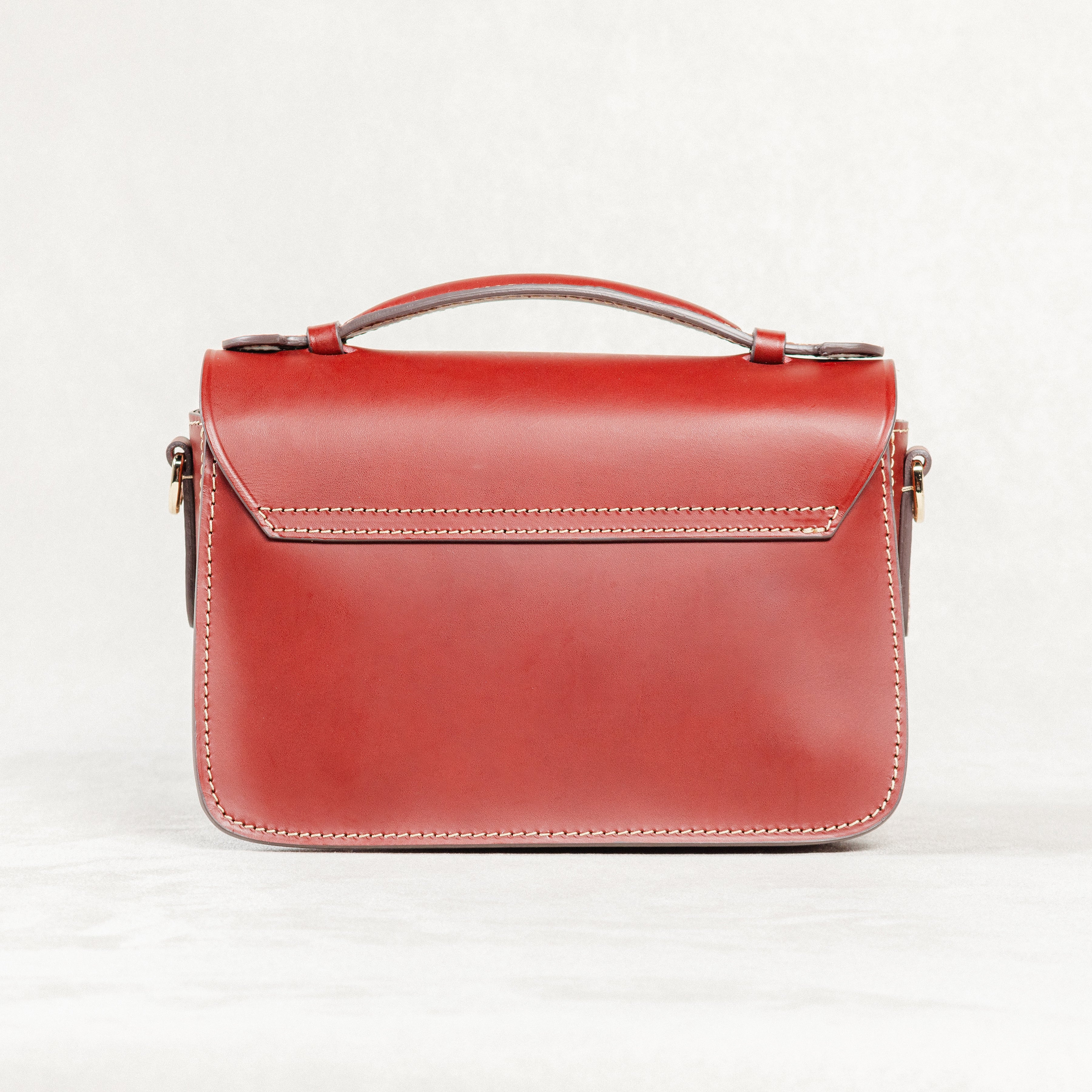  Back view of Brunello leather Mantelet Bag by Freedman's, showing stitching details and top handle.