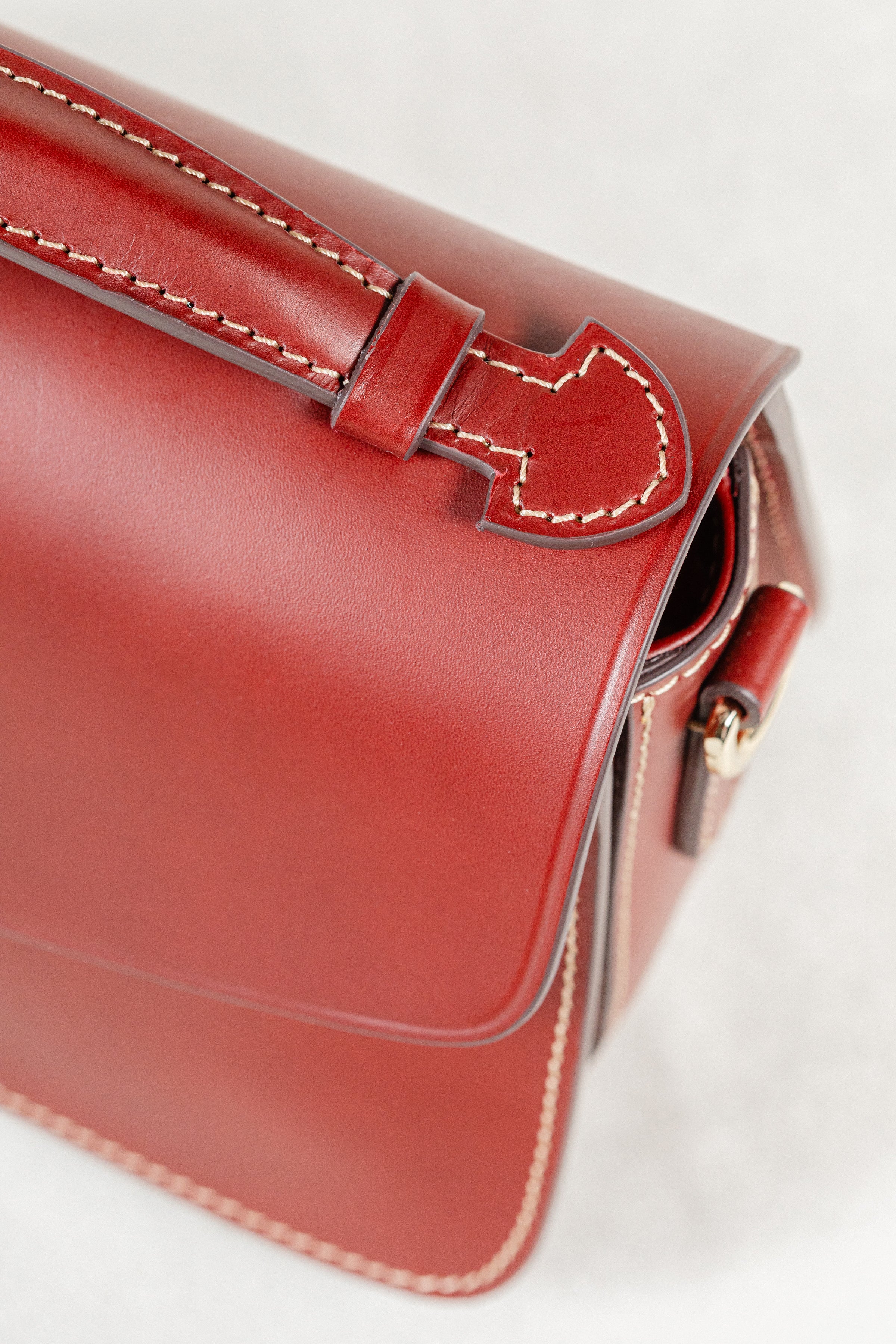 Close-up of Brunello leather Mantelet Bag by Freedman's, highlighting handle construction and contrasting stitching details.