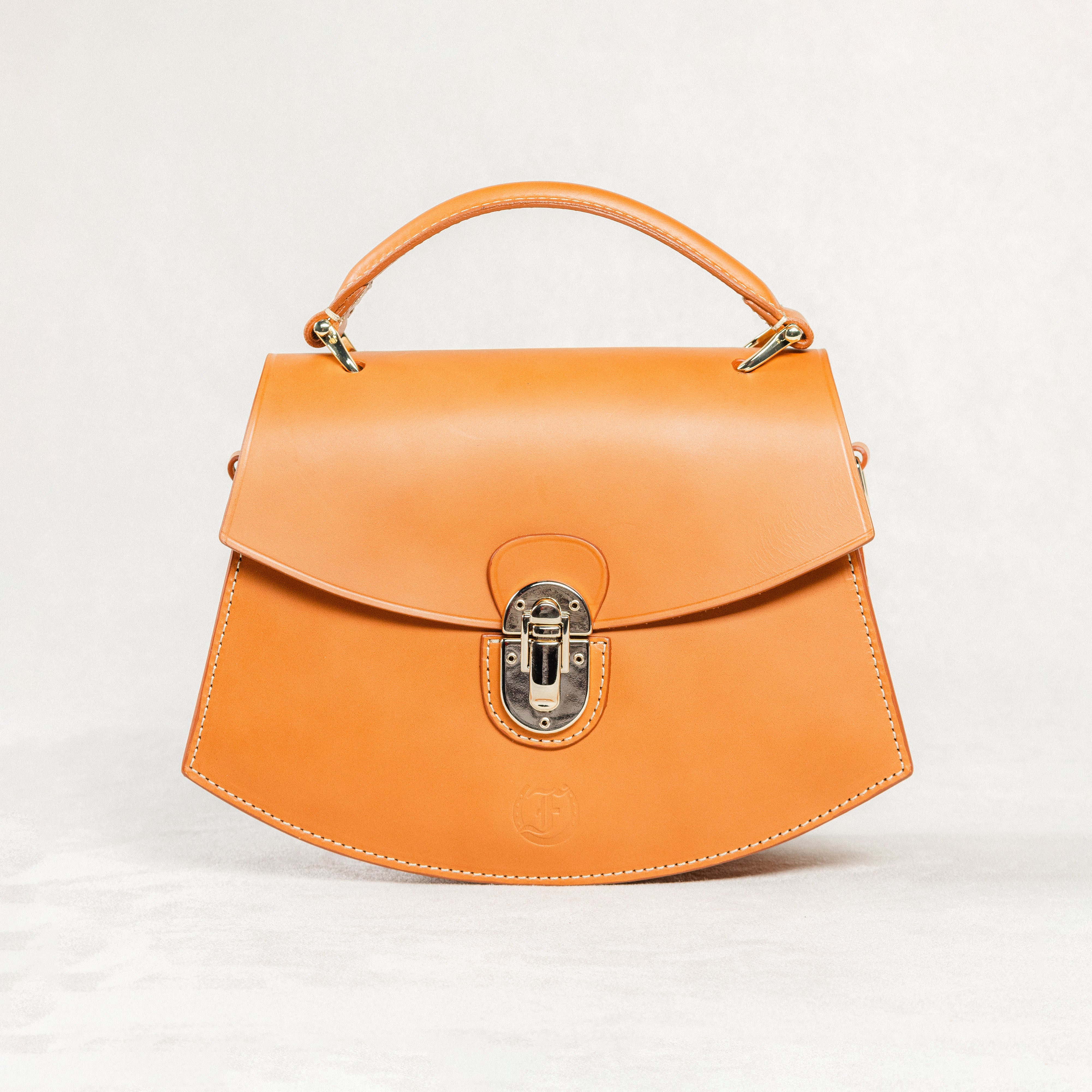 Cognac leather Minibus Bag by Freedman's with structured top handle and gold-tone hardware.