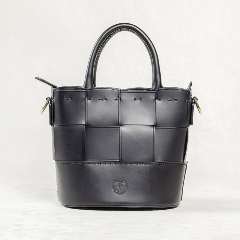 Freedman's Milord Bag, Black leather with a distinctive woven front panel, structured handles, and visible brand logo