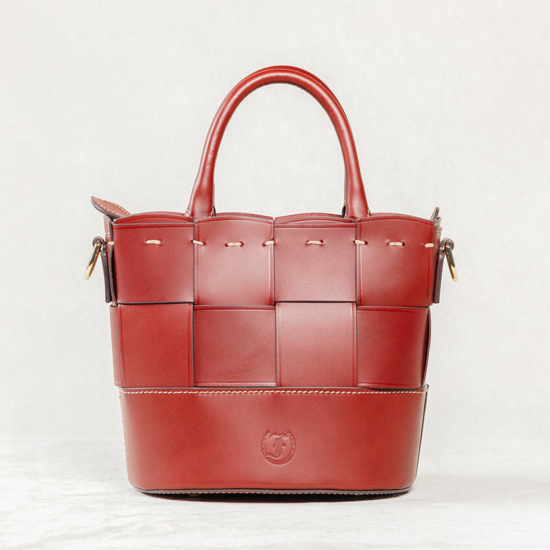 Milord Bag, Brunello leather with a distinctive woven front panel, structured handles, and visible brand logo.