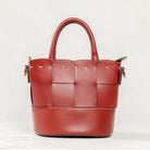 Back view of Brunello leather Milord Bag by Freedman's, showing woven design, structured handles, and stitching details.