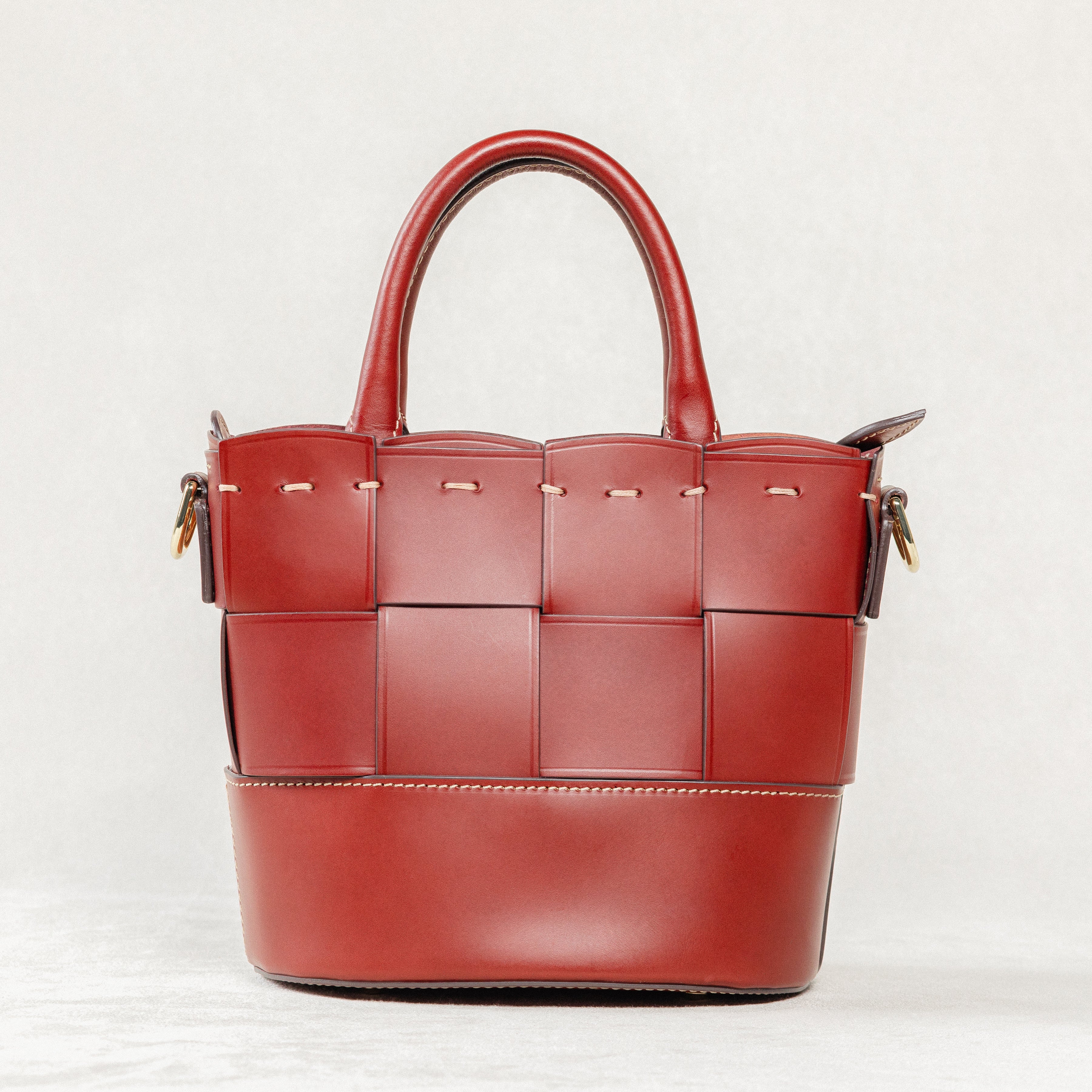 Back view of Brunello leather Milord Bag by Freedman's, showing woven design, structured handles, and stitching details.