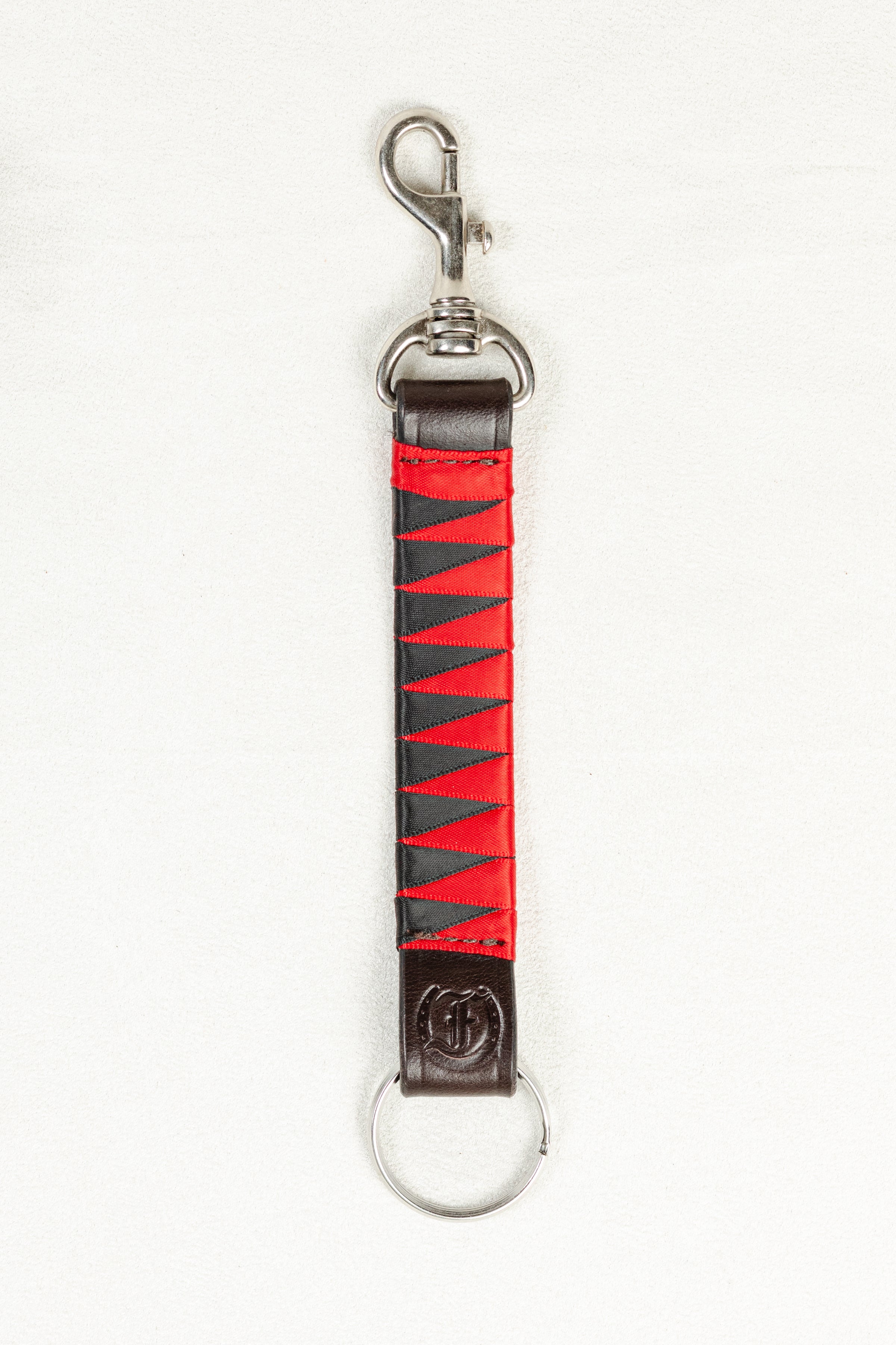 Red and Black satin-finished keychain in dark Havana brown bridle leather with stainless steel clasp and Freedman’s F logo on a white background.