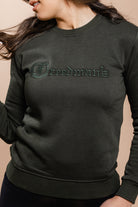 Close up of Freedman's logo on the Freedman's Unisex Sweatshirt