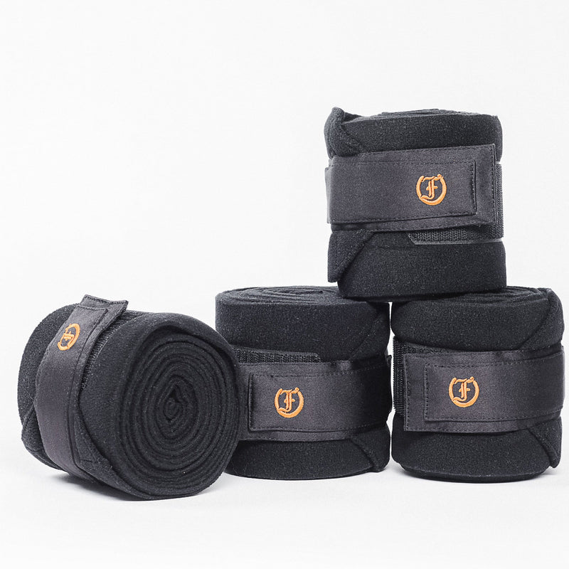 Freedman's Signature Polo Wraps: Set of Four Black Fleece Polo Wraps with Gold Embroidered Brand Logo and Velcro Closures
