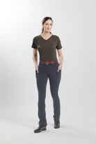 Olive Ladies' Tous les Jours Essential V Neck Tee Shirt, back view showcasing the "Freedman's" print and paired with black jods for an equestrian look.