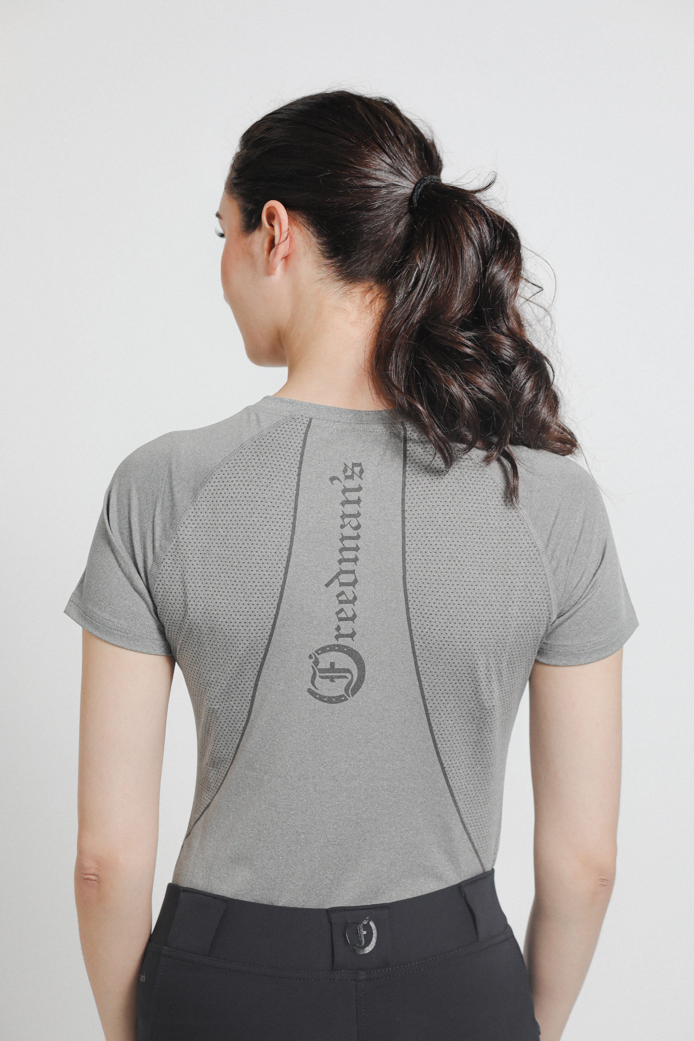 Ladies' tee shirt with "Freedman's" branding on the back.