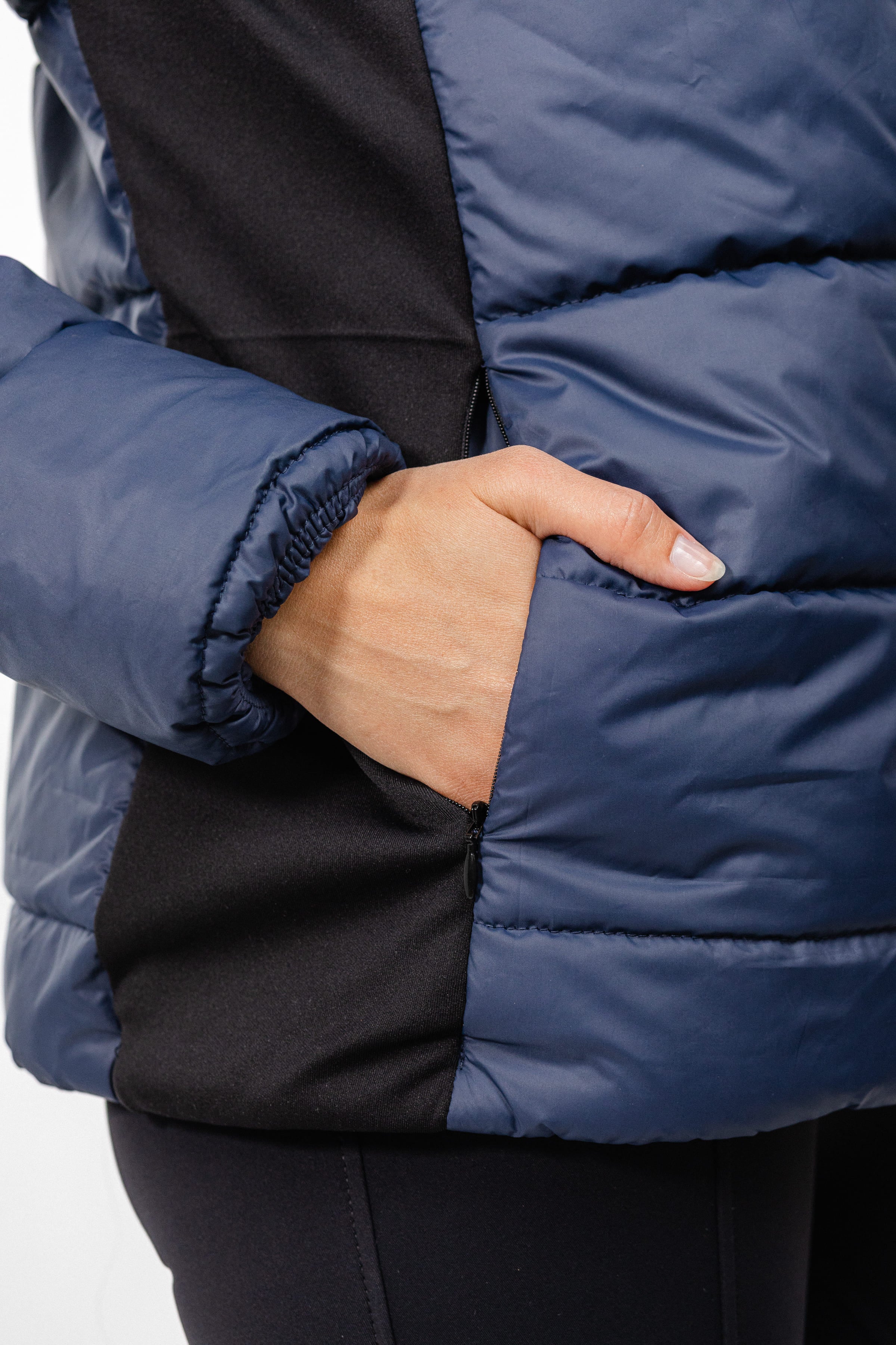 Navy Ladies Winter Bomber Jacket by Freedman's, showing side pocket detail.