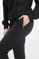 Close-up of Freedman's Ladies' Joggers Showing Brand Logo- side view