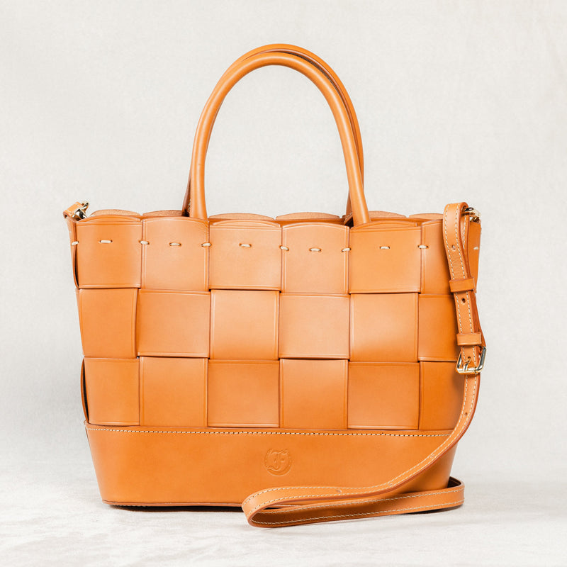 Cognac Manalos Bag by Freedman's, featuring a woven leather design and structured handles.