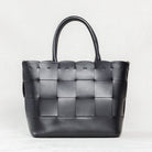 Black Manalos Bag by Freedman's, featuring a woven leather design and structured handles.