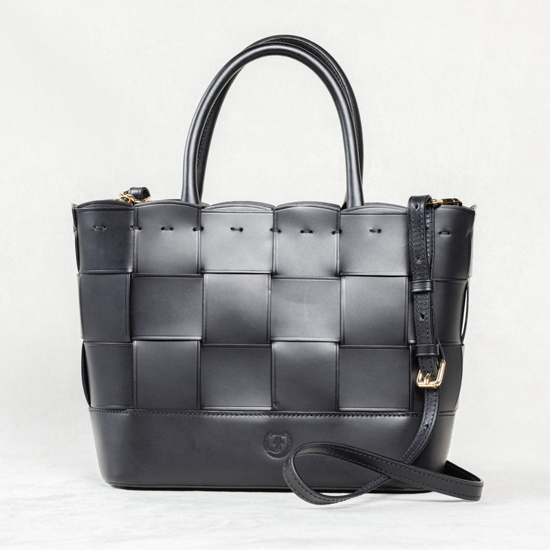 Black Manalos Bag by Freedman's, featuring a woven leather design and structured handles.