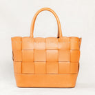 Cognac Manalos Bag by Freedman's, featuring a woven leather design and structured handles.
