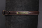 Raised Custom Name Plate Belt in dark brown leather with brass buckle and "FREEDMAN'S" engraved nameplate