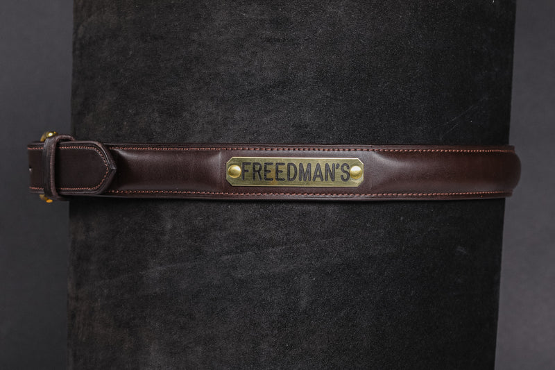 Raised Custom Name Plate Belt in dark brown leather with brass buckle and "FREEDMAN'S" engraved nameplate