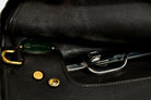 Close-up of the interior of a black leather Victory Pass HP Cutback Saddle, showcasing the gold ring, studs, and silver clasp hardware.