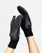 Signature Ladies' II Winter Gloves in black shown on hands, highlighting the waterproof design, adjustable wrist straps, and extended knit cuffs.