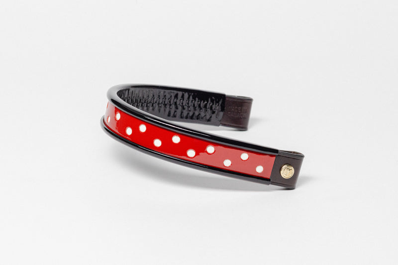 Turned edge browband with red patent leather, white dots, and dark brown leather ends.